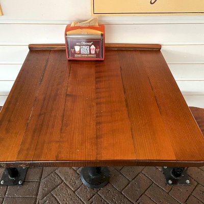 Custom Square Tabletop with Round Stool Seats (Options: 30'' Tabletop, 14'' Diameter Seat Tops, Mature Redwood, Seamless Design, Urethane Finish). Photo Taken 1 Year After Installation. Photo Courtesy of Small Cheval Restaurant, 2815 West Armitage Ave, Chicago, IL 60647.