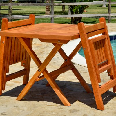 Square Wooden Folding Table (Options: 2 Folding Chairs, Douglas-fir, No Cushions, Standard Tabletop, Checkerboard Design, Rounded Corners, No Umbrella Hole, Transparent Premium Sealant). Photo Courtesy of El Laurel, Ensenada, Mexico.