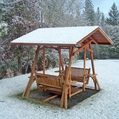 St. Anthony's Face to Face Gliders (Adult Size, California Redwood, With Beverage Armrests, No Kid's Platform,  XW Roof, No Engraving, Transparent Premium Sealant). Photo Courtesy of Rosalie Hurd of Grants Pass, Oregon.