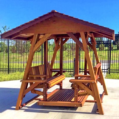 St. Anthony's Face to Face Gliders (XW, California Redwood, No Kid's Platform, XW Roof, No Engraving, Transparent Premium Sealant). Photo Courtesy of Wealshire of Medina, MN.
