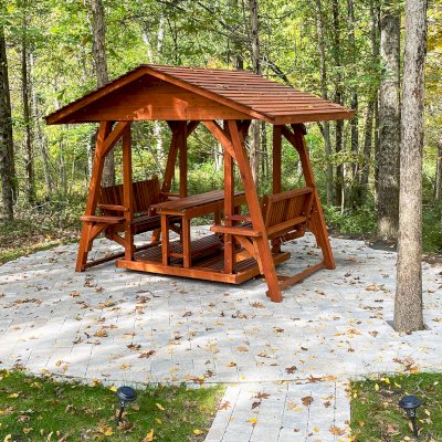St. Anthony's Face to Face Gliders (Options: Extra Wide Size, Mature Redwood, With Beverage Armrests, with Custom Table, No Kid's Platform, XW Roof, No Engraving, Transparent Premium Sealant). Photo Courtesy of The Jones Family of Cortlandt Manor, New York