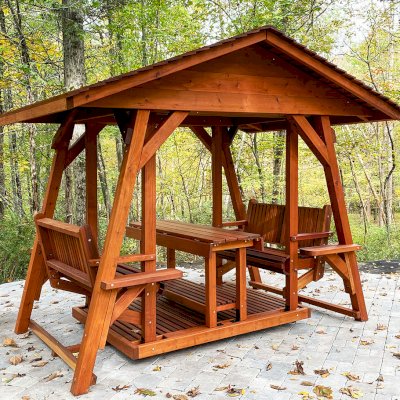 St. Anthony's Face to Face Gliders (Options: Extra Wide Size, Mature Redwood, With Beverage Armrests, with Custom Table, No Kid's Platform, XW Roof, No Engraving, Transparent Premium Sealant). Photo Courtesy of The Jones Family of Cortlandt Manor, New York