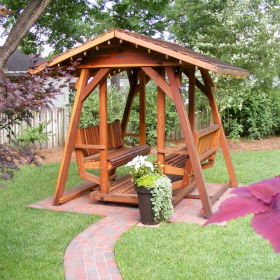 St. Anthony's Face to Face Gliders (XXL, California Redwood, No Kid's Platform, XW Roof, No Engraving, Transparent Premium Sealant). Photo Courtesy of J. Hardwick of Dothan, Alabama.