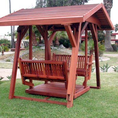 St. Anthony's Face to Face Gliders (XW, Old-Growth Redwood, No Kid's Platform, XW Roof, No Engraving, Transparent Premium Sealant).