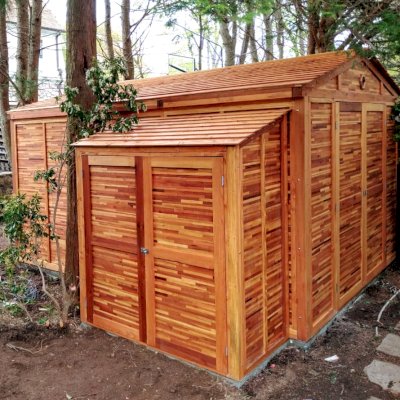 Storage Mini Barns (Options: 11' W, 15' D, 8' H, Mosaic Redwood, Double Doors Opening Out From Center, No Shelves, Transparent Premium Sealant).  A Storage Shed Shown in Front of the Storage Mini Barn. Photo Courtesy of Jake VanderKamp of Westport, Connecticut.