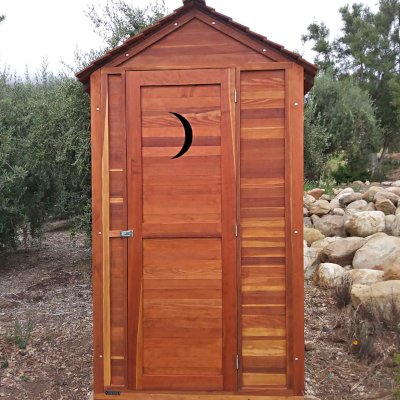Storage Mini Barns (Options: 4.5' W, 4.5' D, 8.5' H, California Redwood, Single Door, Transparent Premium Sealant). Crescent Moon Cutout was Optional Request by Customer. Photo Courtsy of J. Massar of Carpinteria, CA.