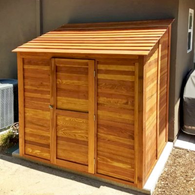 Storage Sheds (Options: 7' W, 4.5' D, 7' H, California Redwood, Single Door, One Shelf on the Side Opposite the Door, 42" H, Transparent Premium Sealant). Photo Courtesy of J. Lewis of Mountain View, CA.