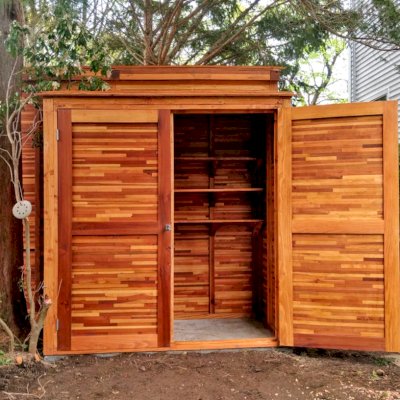 Storage Sheds (Options: 7' W, 3' D, 7' H, Mosaic Redwood, Double Doors, Three Shelves at 28" H & 14" H, Transparent Premium Sealant). Photo Also Shows a Storage Mini Barn. Photo Courtesy of J. VanderKamp of Westport, Connecticut.