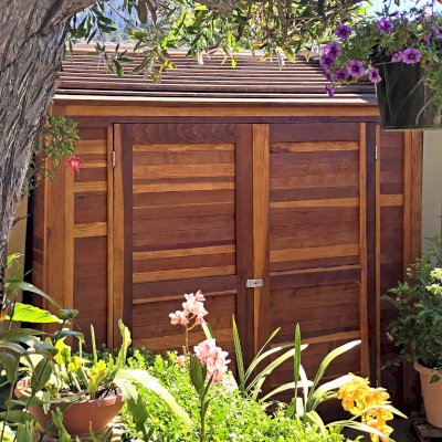 Storage Sheds (Options: 7' W, 4.5' D, 7' H, California Redwood, Double Doors, No Shelving, With Deck, Transparent Premium Sealant). Photo Courtesy of I. Speiser of Carmel, CA