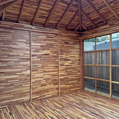 Sun Gazebo with Sliding Doors (Options: 14' L x 12' W, Mosaic Redwood, 8 ft Wall Height, 4' x 6' Skylight, with 3 Sliding Walls and One Fixed Wood Wall, Complete Floor, with Metal Roof, Transparent Premium Sealant). Photo Courtesy of A. Winings of San Jose, CA.