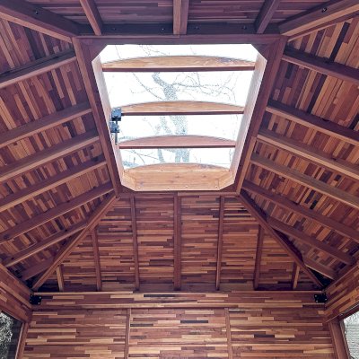 Sun Gazebo with Sliding Doors (Options: 14' L x 12' W, Mosaic Redwood, 8 ft Wall Height, 4' x 6' Skylight, with 3 Sliding Walls and One Fixed Wood Wall, Complete Floor, with Metal Roof, Transparent Premium Sealant). Photo Courtesy of A. Winings of San Jose, CA.