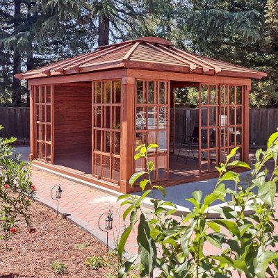 Custom Sun Gazebo with Sliding Doors (Options: 16' L x 14' W, Douglas-fir, 3 Sides with Sliding Doors and 1 Side with Solid Wall, 8 ft Wall Height, 4' x 6' Skylight, with Floor, Transparent Premium Sealant). Clear Polycarbonate Windows by Custom Request. Photo Courtesy of B. Narayanan of Pleasanton, CA.