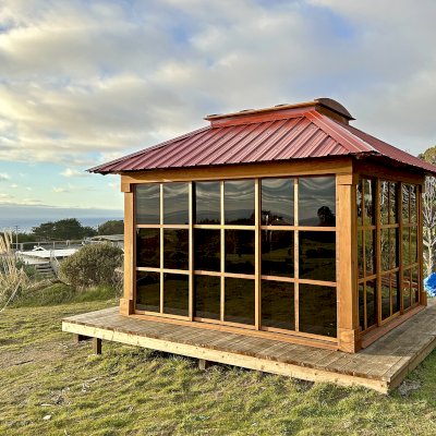 Sun Gazebo with Sliding Doors (Options: 12' L x 10' W, California Redwood, 7 ft Wall Height, 4' x 6' Skylight, with 4 Sliding Walls, No Floor, with Metal Roof, Transparent Premium Sealant). Photo Courtesy of C. Turner of Bodega Bay, CA.