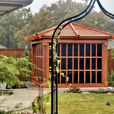 Sun Gazebo with Sliding Doors (Options: 12' L, 10' W, Mature Redwood, 7 ft Wall Height, Without Skylight, Standard Wood Roof, Hardware Kit for Stone, Brick or Concrete, Complete Floor, Transparent Premium Sealant). Photo Courtesy of J. Davidson of Plano, Texas.
