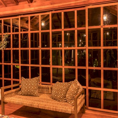 Sun Gazebo with Sliding Doors (Options: 14' L, 14' W, California Redwood, 8 ft Wall Height, 4' x 4' Skylight, Complete Floor, Transparent Premium Sealant). Photo Courtesy of M. Wunderman of Los Angeles, CA.