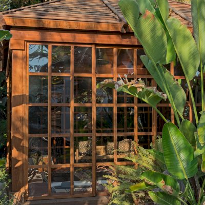Sun Gazebo with Sliding Doors (Options: 14' L, 14' W, California Redwood, 8 ft Wall Height, 4' x 4' Skylight, Complete Floor, Transparent Premium Sealant). Photo Courtesy of M. Wunderman of Los Angeles, CA.