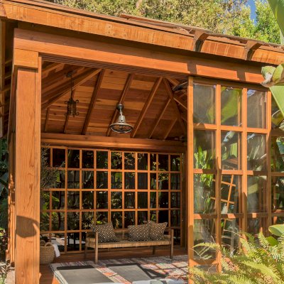 Sun Gazebo with Sliding Doors (Options: 14' L, 14' W, California Redwood, 8 ft Wall Height, 4' x 4' Skylight, Complete Floor, Transparent Premium Sealant). Photo Courtesy of M. Wunderman of Los Angeles, CA.
