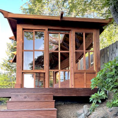 Custom Sun Gazebo with Sliding Doors (Options: Irregular Shape, 20' L x 12' W, California Redwood, 7 ft Wall Height, With Custom Skylight, Without Floor [Installed on a Deck], Transparent Premium Sealant). Clear Polycarbonate Windows by Custom Request. Photo Courtesy of P. Gupta of Los Gatos, CA.