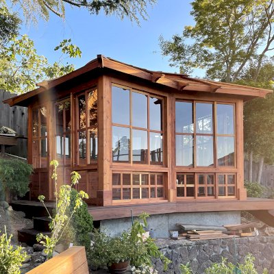Custom Sun Gazebo with Sliding Doors (Options: Irregular Shape, 20' L x 12' W, California Redwood, 7 ft Wall Height, With Custom Skylight, Without Floor [Installed on a Deck], Transparent Premium Sealant). Clear Polycarbonate Windows by Custom Request. Photo Courtesy of P. Gupta of Los Gatos, CA.