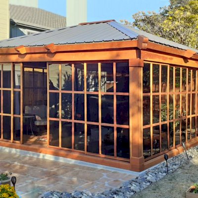 Sun Gazebo with Sliding Doors (Options: Custom Size 16' L x 14' W, California Redwood, 8 ft Wall Height, Without Skylight, Complete Floor, with Metal Roof, Transparent Premium Sealant). Photo Courtesy of R. Graham-Helwig of Foster City, California.