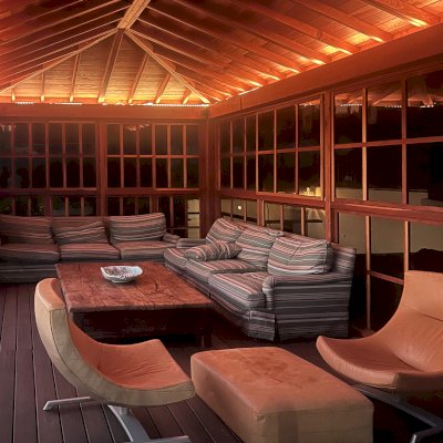 Sun Gazebo with Sliding Doors (Options: 20' L x 12.5' W, California Redwood, 9 ft Wall Height, No Skylight, with 4 Sliding Walls, No Floor, No Roofing, Transparent Premium Sealant). Photo Courtesy of R. Erickson of Honolulu, Hawaii.