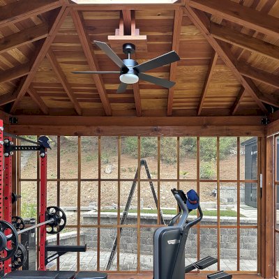 Sun Gazebo with Sliding Doors (Options: 20' L x 16' W, California Redwood, 8.5 ft Wall Height, 4' x 6' Skylight, Complete Floor, Shiplap Roof, TV Mount and Electrical Cutouts by Custom Request, Acrylic Color Bronze, Transparent Premium Sealant). Photo Courtesy of S. & L. McEwan of San Juan Capistrano, CA.