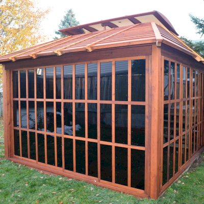 Sun Gazebo with Sliding Doors (Options: 12' L, 12' W, Mature Redwood, 4' x 8' Skylight, No Flooring, Transparent Premium Sealant). Photo Courtesy of Stephane Jean of Chicoutimi, Quebec.