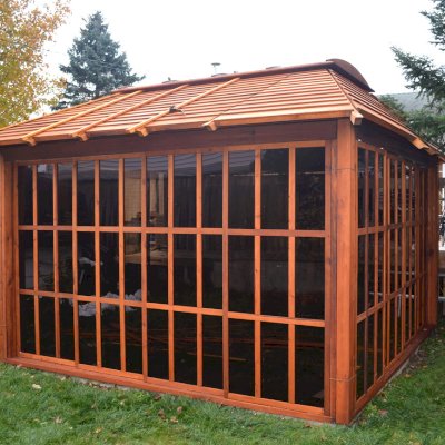 Sun Gazebo with Sliding Doors (Options: 12' L, 12' W, Mature Redwood, 4' x 8' Skylight, No Flooring, Transparent Premium Sealant). Photo Courtesy of Stephane Jean of Chicoutimi, Quebec.