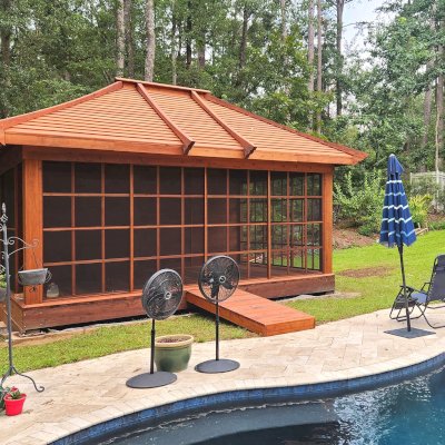 Sun Gazebo with Sliding Doors (Options: 20' L x 14' W, Mature Redwood, 8 ft Wall Height, Without Skylight, with 3 Sliding Walls and One Fixed Wood Wall, Custom Complete Floor and Bridge, Transparent Premium Sealant). Photo Courtesy of T. Bolek of Tallahassee, Florida.