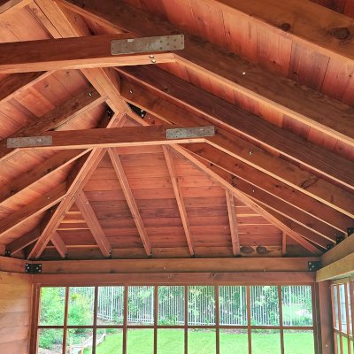 Sun Gazebo with Sliding Doors (Options: 20' L x 14' W, Mature Redwood, 8 ft Wall Height, Without Skylight, with 3 Sliding Walls and One Fixed Wood Wall, Custom Complete Floor and Bridge, Transparent Premium Sealant). Photo Courtesy of T. Bolek of Tallahassee, Florida.