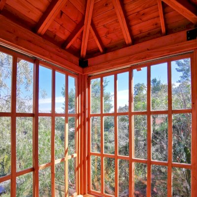Sun Gazebo with Sliding Doors (Options: Custom Size 6' L x 6' W, Douglas-fir, 7 ft Wall Height, Without Skylight, Complete Floor, Transparent Premium Sealant). Clear Polycarbonate Windows by Custom Request. Photo Courtesy of T. Standing of Hollywood, CA.