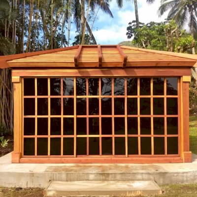 Sun Gazebo with Sliding Doors (Options: 14' L, 12' W, California Redwood, 4' x 4' Skylight, Standard Wood Roof, Complete Floor, Transparent Premium Sealant). Photo Courtesy of C. Tokars of Kaneohe, Hawaii.
