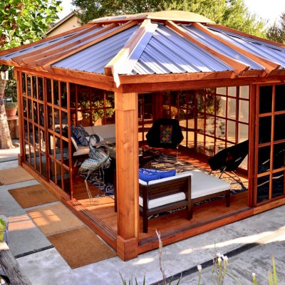 Sun Gazebo with Sliding Doors (Options: 14' L, 12' W, California Redwood, 4' x 6' Skylight, Complete Floor, Transparent Premium Sealant). Metal roof added by custom request. Photo Courtesy of A. Ramon of South San Francisco, CA. Note: Metal Roof provided by Home Depot: 12ft. Classic Rib Steel Roof Panel in Charcoal, Model #2313417, Internet #204255071
