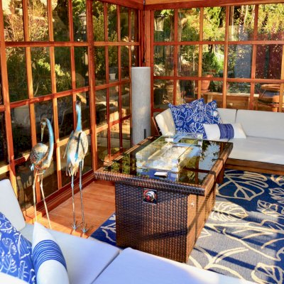 Sun Gazebo with Sliding Doors (Options: 14' L, 12' W, California Redwood, 4' x 6' Skylight, Complete Floor, Transparent Premium Sealant). Metal roof added by custom request. Photo Courtesy of A. Ramon of South San Francisco, CA.