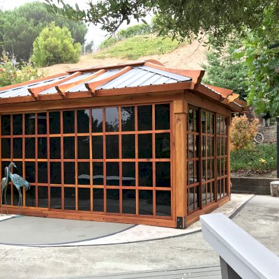 Sun Gazebo with Sliding Doors (Options: 14' L, 12' W, California Redwood, 4' x 6' Skylight, Complete Floor, Transparent Premium Sealant). Metal roof added by custom request. Photo Courtesy of A. Ramon of South San Francisco, CA. Note: Metal Roof has Provided by Home Depot: 12ft. Classic Rib Steel Roof Panel in Charcoal. Model #2313417, Internet #204255071