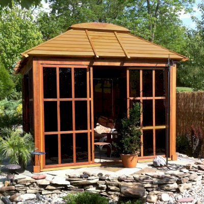 Sun Gazebo with Sliding Doors (Options: 12' L, 10' W, Mature Redwood, 4' x 8' Skylight, No Flooring, Transparent Premium Sealant). Cement Anchors on 4 x 4 posts by Custom Request. Photo Courtesy of Clay Rutledge of Audubon, Pennsylvania.