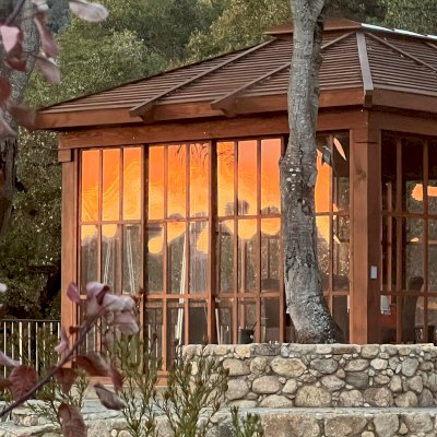 Sun Gazebo with Sliding Doors (Options: Custom Size 20' L x 14' W, Douglas-fir, 9 ft Wall Height, With 4' x 8' Skylight, Complete Floor, with Shiplap Roof in Mature Redwood, Transparent Premium Sealant). Photo Courtesy of K. Gottfredson of Carmel Valley, CA.