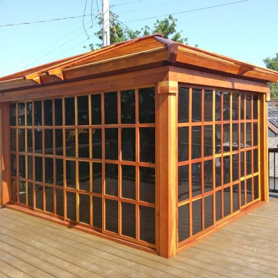 Sun Gazebo with Sliding Doors (Options: 14' L, 10' W, California Redwood, No Skylight, No Flooring, Transparent Premium Sealant). Photo Courtesy of L. Lundsten of St. Paul, MN.