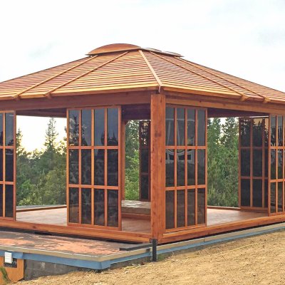 Sun Gazebo with Sliding Doors (Options: 16' L, 16' W, California Redwood, 4' x 4' Skylight, No Flooring, Transparent Premium Sealant). Photo shows only 8 doors/panels, the rest were installed after the photo was taken. Photo Courtesy of L. Moresco of San Francisco, CA.