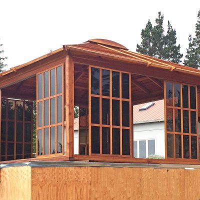 Sun Gazebo with Sliding Doors (Options: 16' L, 16' W, California Redwood, 4' x 4' Skylight, No Flooring, Transparent Premium Sealant). Photo shows only 8 doors/panels, the rest were installed after the photo was taken. Photo Courtesy of L. Moresco of San Francisco, CA.