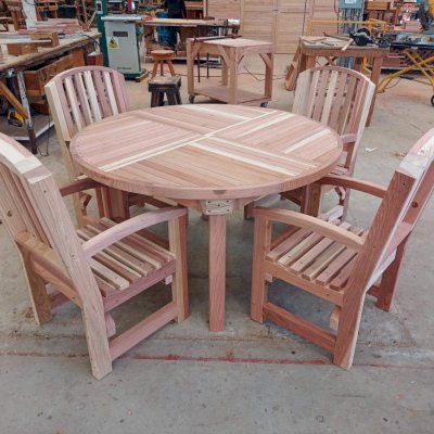 Terrace Round Wooden Table Under Construction (Options: 4 1/2', 4 Chairs, California Redwood, Luna, All Arm Chairs, Standard Tabletop, No Umbrella Hole). 