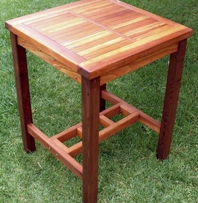 3 GRADES OF REDWOOD SHOWN. Terrace Wood Cocktail Table (Options: Square Cocktail Table, No Seating, 42" H, Slatted Tabletop, Squared Corners, Transparent Premium Sealant). Dark legs: Old-Growth, supports near the ground in-between the legs: Mature Redwood and tabletop: Redwood.