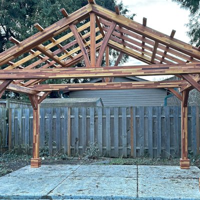 Breezy Pavilion Under Construction (Options: 10' L x 16' W, Mosaic Redwood, 8.5' H Posts, Transparent Premium Sealant).