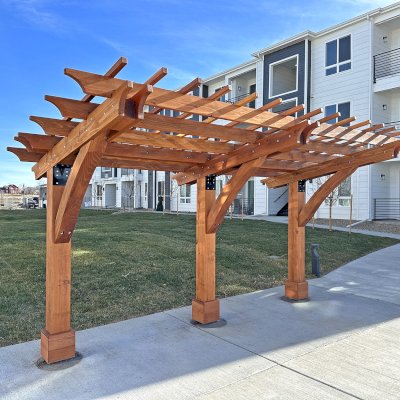Cantilevered Pergola (Options: 8in x 8in Post Thickness, 15' Length x 8' Width, California Redwood, 7 ft Posts Height, 3-Post High-Wnd Anchor Kit, Transparent Premium Sealant). Photo Courtesy of R. Pike of Denver, CO.
