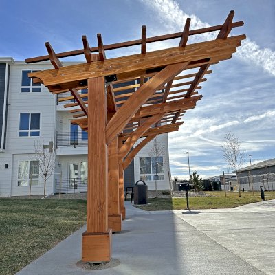 Cantilevered Pergola (Options: 8in x 8in Post Thickness, 15' Length x 8' Width, California Redwood, 7 ft Posts Height, 3-Post High-Wnd Anchor Kit, Transparent Premium Sealant). Photo Courtesy of R. Pike of Denver, CO.