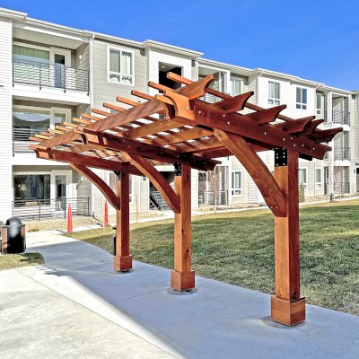 Cantilevered Pergola (Options: 8in x 8in Post Thickness, 15' Length x 8' Width, California Redwood, 7 ft Posts Height, 3-Post High-Wnd Anchor Kit, Transparent Premium Sealant). Photo Courtesy of R. Pike of Denver, CO.