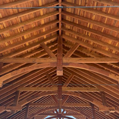 Cardinal's Nest Pavilion (Options: 60' x 40', California Redwood, Horizontal Decorative Trims for All Posts, 15' H Posts, 10x10 Posts, 2 Ceiling Fan Bases, Transparent Premium Sealant). Pavilion Installed in Faith Walk Community Fitness Park in Coeur d'Alene, Idaho.