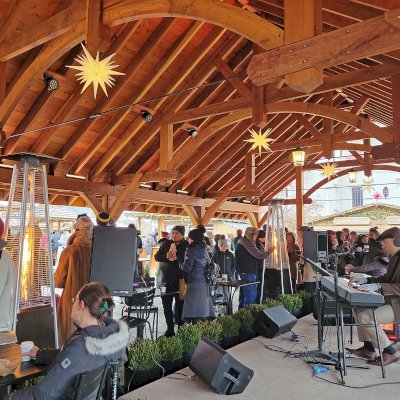 Cardinal's Nest Pavilion (Options: 80' L x 34' W, California Redwood, Transparent Premium Sealant). Pavilion Installed in Carmel, IN, for the Carmel Christkindlmarkt, Named Best Holiday Market in the Country in 2021.