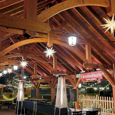 Cardinal's Nest Pavilion (Options: 80' L x 34' W, California Redwood, Transparent Premium Sealant). Pavilion Installed in Carmel, IN, for the Carmel Christkindlmarkt, Named Best Holiday Market in the Country in 2021.
