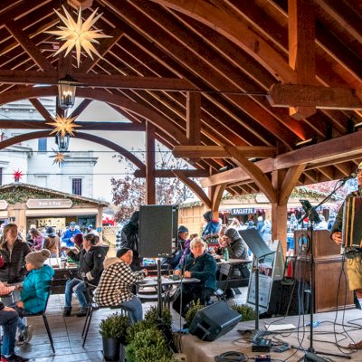 Cardinal's Nest Pavilion (Options: 80' L x 34' W, California Redwood, Transparent Premium Sealant). Pavilion Installed in Carmel, IN, for the Carmel Christkindlmarkt, Named Best Holiday Market in the Country in 2021.
